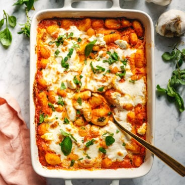 Baked gnocchi in pan with spoon