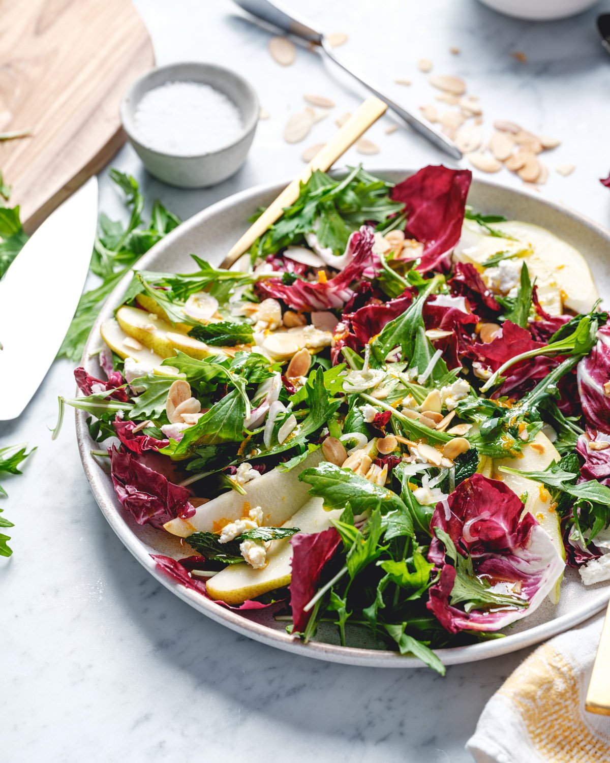 Winter salad, salad on plate with radicchio, pear, and citrus dressing