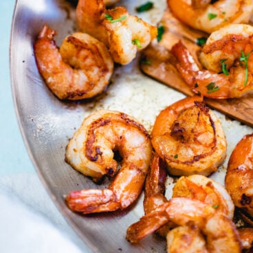 Sauteed shrimp in pan.